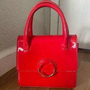 Red Mini Bag with Glossy Finish and Structured Design